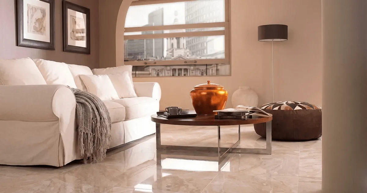 Modern living room with professionally installed marble flooring, a beige sofa, coffee table in Arvada, CO